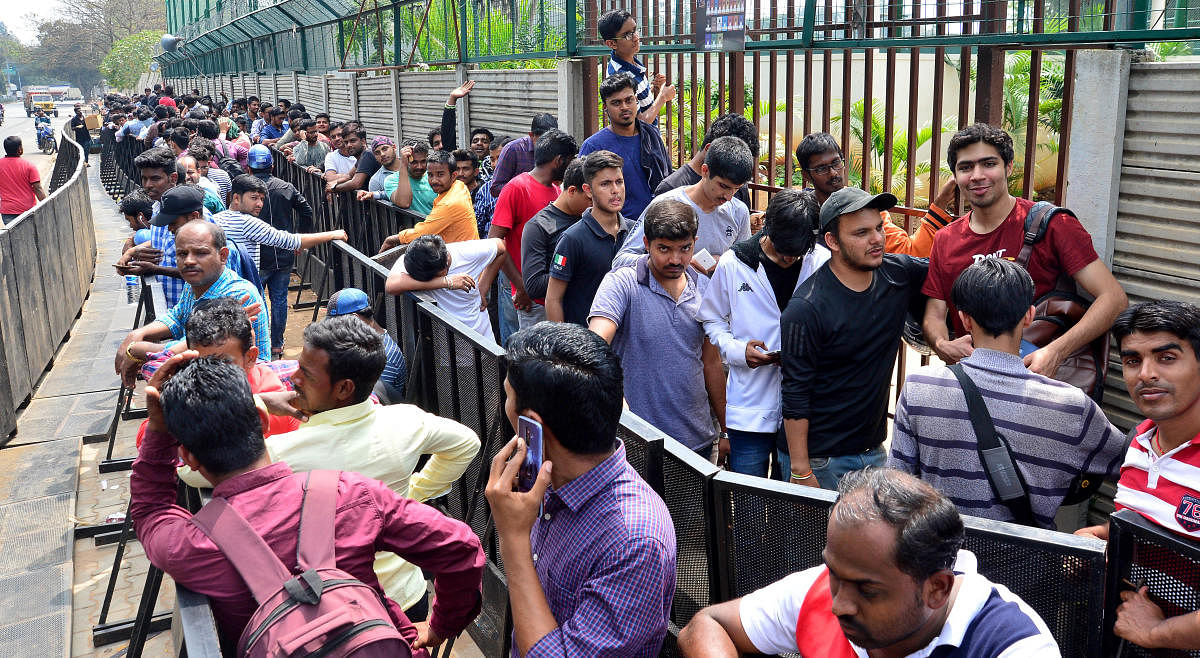PASSION UNLIMITED Fans line up to buy tickets for the India-Australia T20 clash at the Chinnaswamy Stadium. DH PHOTO