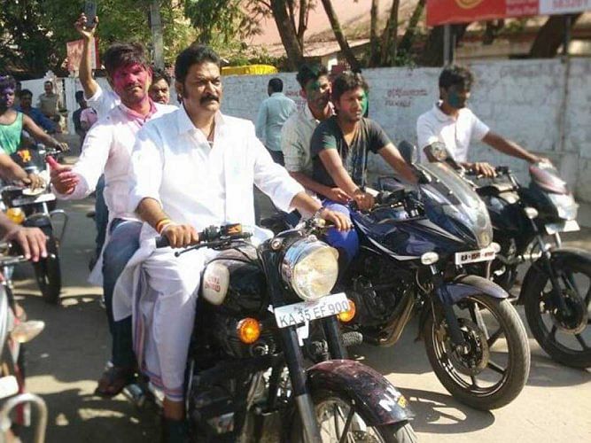 Anand Singh with J N Ganesh (riding pillion) in happier times. DH photo