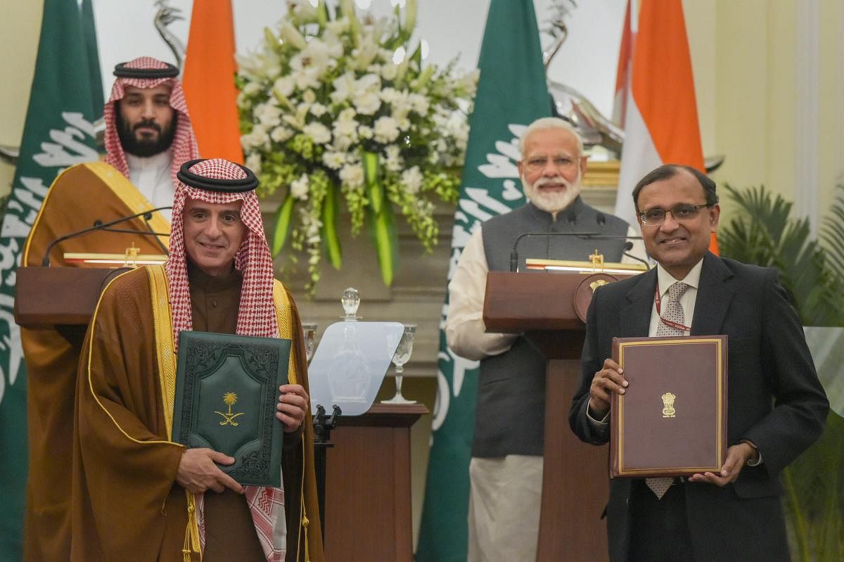 Prime Minister Narendra Modi and the Crown Prince of Saudi Arabia Prince Mohammed Bin Salman Bin Abdulaziz Al-Saud witness the exchange of MoU files between Secretary(ER) T S Tirumurti and Saudi Arabia's Minister of State for Foreign Affairs Adel Al-Jubeir, at Hyderabad House in New Delhi, Wednesday, February 20, 2019. (PTI Photo)