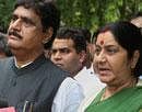 Senior BJP leader Sushma Swaraj with Gopinath Munde addresses the media after their meeting in New Delhi on Wednesday. PTI