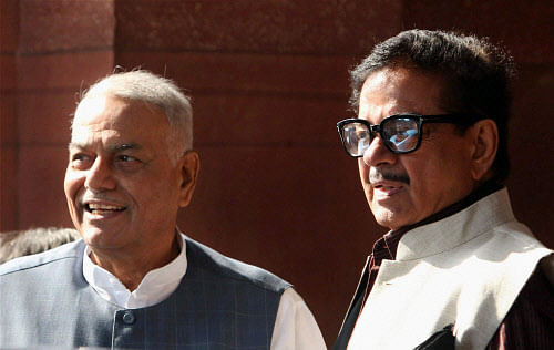BJP members Yashwant Sinha and Shatrughan Sinha at Parliament House on the first day of its winter session in New Delhi on Thursday. PTI Photo by Manvender Vashist