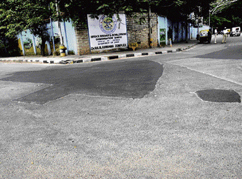 eyewash The repair work done in front of Raj Bhavan before the President's visit to the City.  dh photo by shivakumar bh
