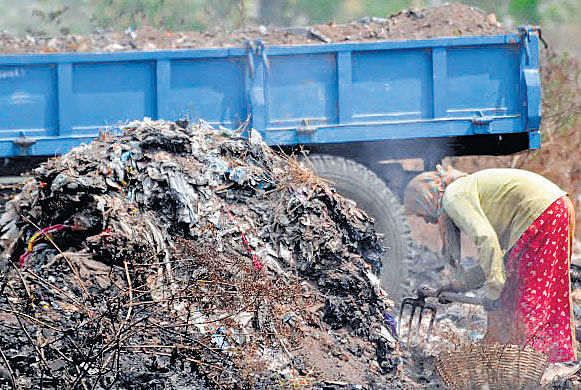 Garbage transported in trucks are dumped by drivers at vacant sites, much to the chagrin of residents. DH PHOTO