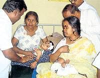 Hurt: An 8-year-old baby who was injured in the accident, undergoing treatment at a government hospital in Anekal on Monday.  dh photos
