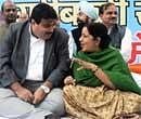 BJP President Nitin Gadkari and leader of Opposition Sushma Swaraj speakas they take part in a protest against food price rises in New Delhi on Wednesday. AFP