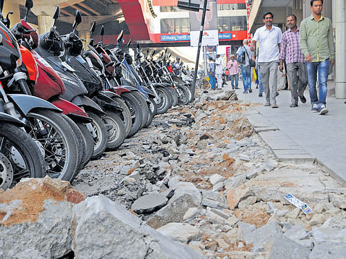 Kerb stones on the pavement of MG&#8200;Road were removed on Wednesday as part of the road upgrade work. dh photo