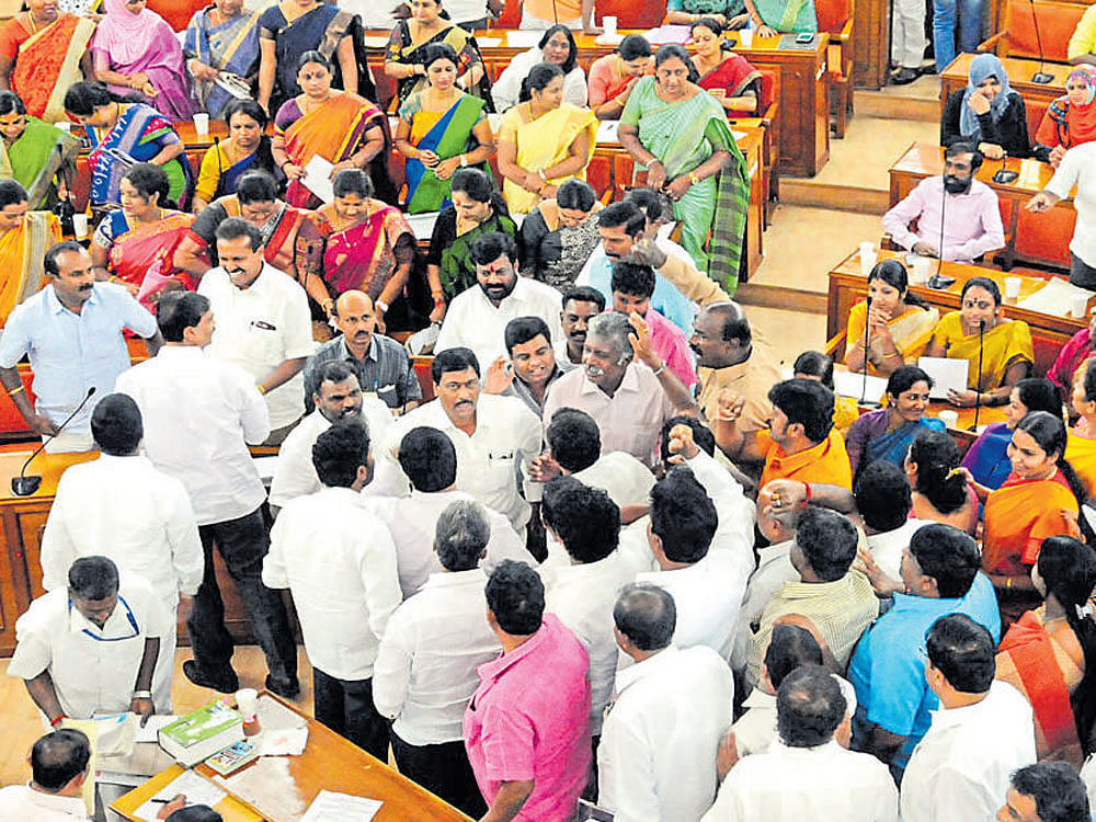 Congress and BJP&#8200;members argue with each other during the BBMP&#8200;Council meeting on Tuesday. DH&#8200;photo