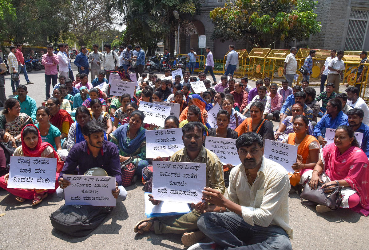 Members of BBMP Computer Operators Union staging protest demanding appoint 274 Data entry operators (DEO)as per court order, and give the salary, remit ESI and EPF amount to workers account and others in front of BBMP Office in Bengaluru on Thursday. Photo by S K Dinesh