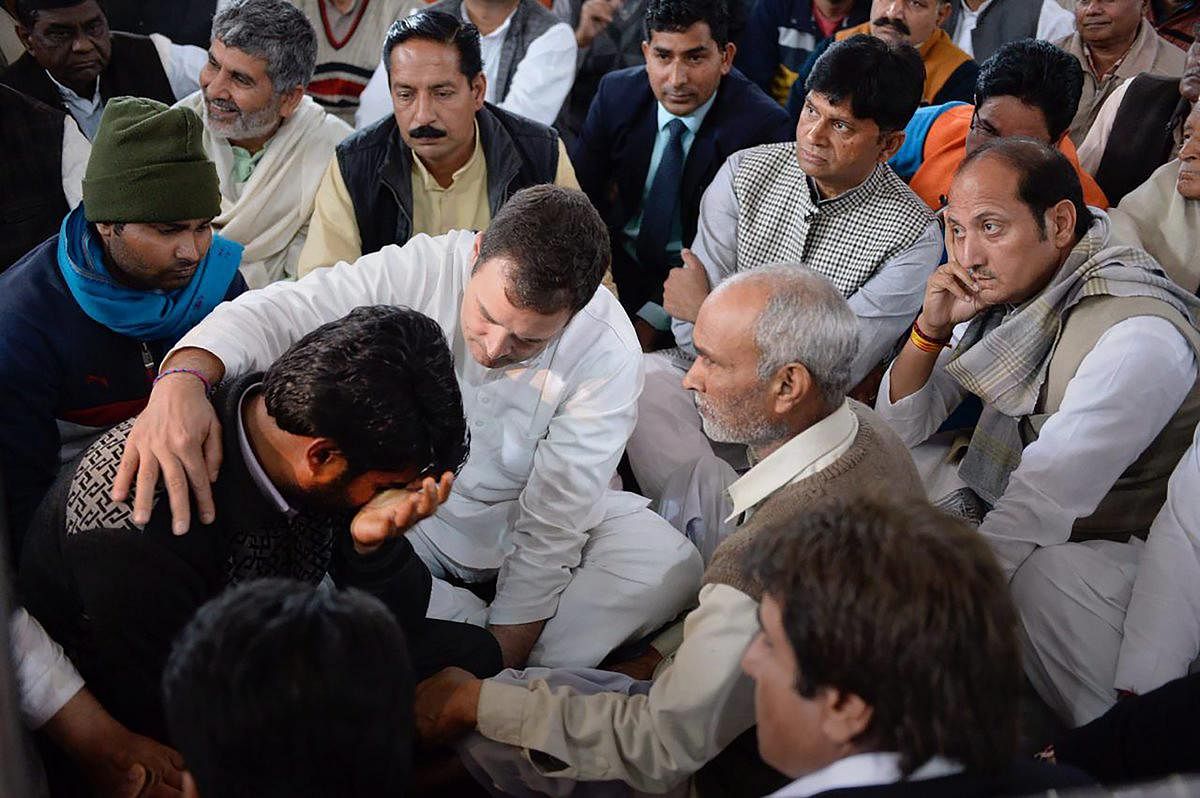 Congress president Rahul Gandhi meets the family members of the slain CRPF jawan Amit Kumar Kori, who lost his life in the Pulwama terror attack, at his residence in Shamli on Wednesday. (PTI Photo)