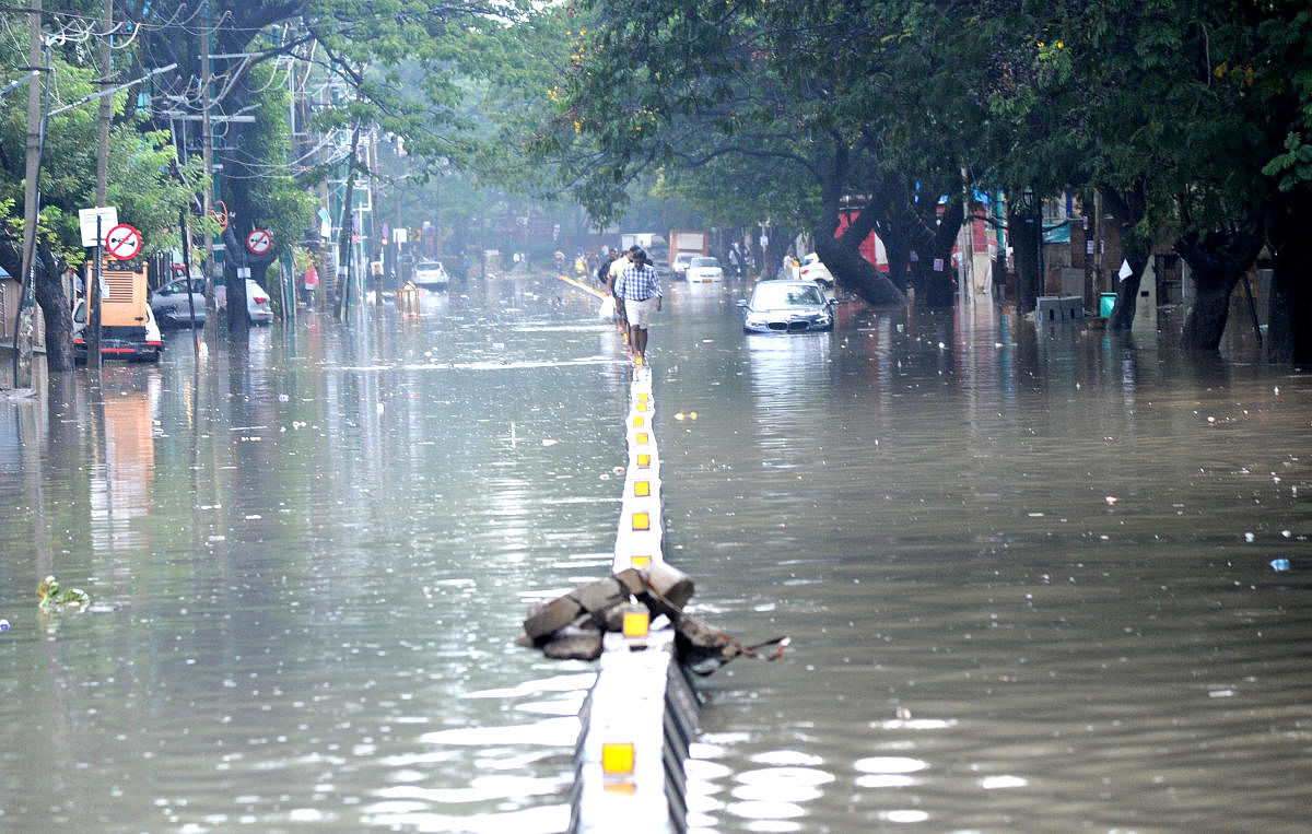 The BBMP has vowed to avert flooding this monsoon. This DH file picture shows a flooded 80 Feet Road in Koramangala 4th Block last October. 