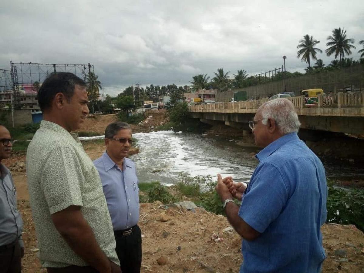 BBMP commissioner M Maheshwar Rao (left) along with officials inspect the bridge on Sunday.