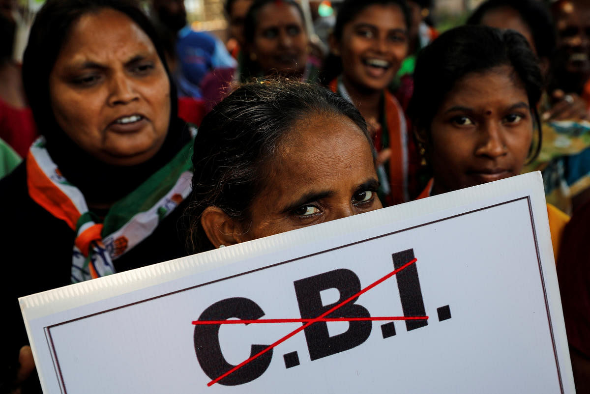 Congress workers protest near the Central Bureau of Investigation (CBI) building in Mumbai. REUTERS