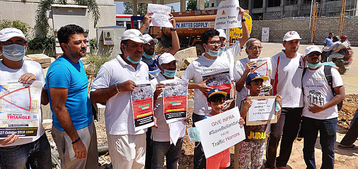 The residents of Bellandur region formed human chain demanding better infrastructure facilities from BBMP on Saturday.