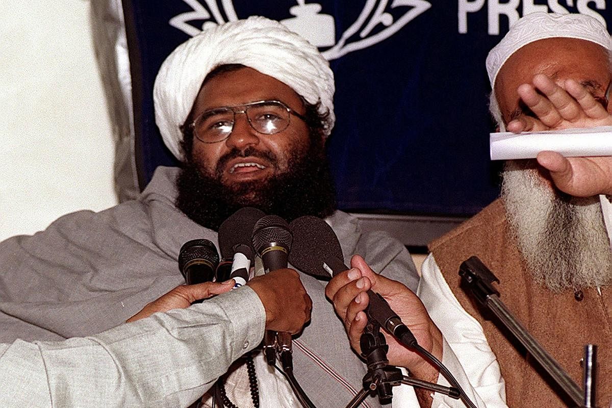 (FILES) In this photograph taken on February 4, 2000, Masood Azhar (L), chief of the Jaish-e-Mohammad (JeM), addresses a press conference in Karachi. - For eight days in 1999 the world watched in horror as hijackers diverted an Indian Airlines flight to A
