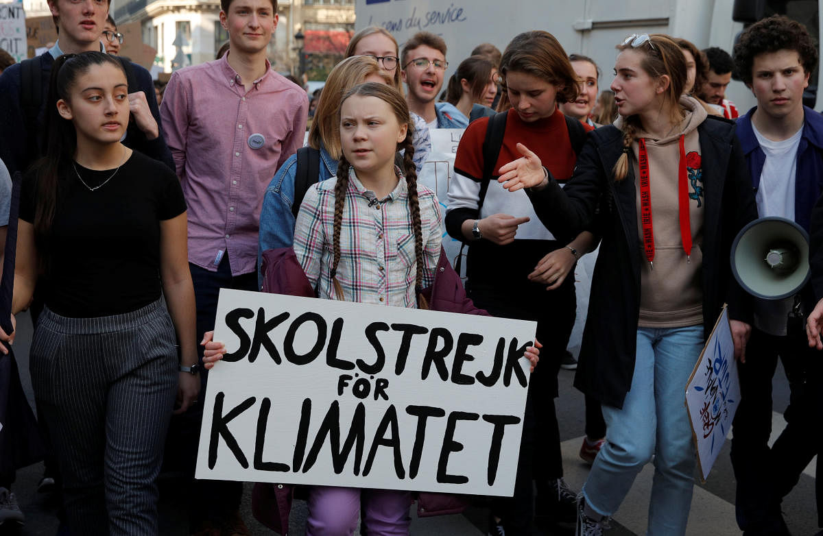 16-year-old Swedish environmental activist Greta Thunberg and Anuna De Wever, a Belgian climate student activist, take part in a protest claiming for urgent measures to combat climate change, in Paris, France, February 22, 2019. (REUTERS)
