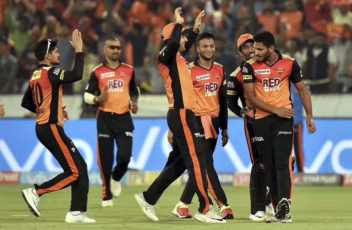 Jubilation: Sunrisers Hyderabad's Basil Thampi (first from right) celebrates with team-mates after dismissing Chris Gayle of Kings XI Punjab on Thursday. PTI