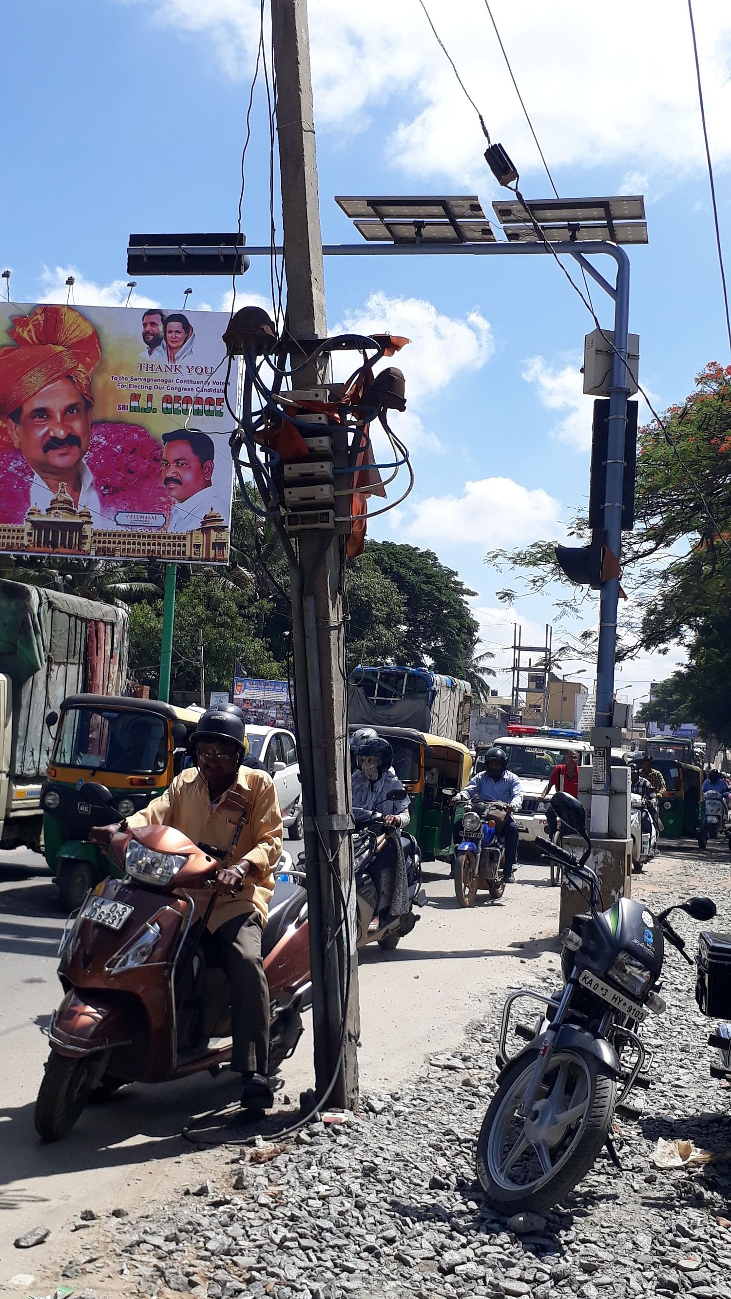 This pole in Lingararajapuramhas cables extending on to the road.