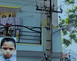 precarious: The transmission line, which Reehan (inset) innocently tried to hold proved costly for him. The cable almost passes through the first floor of the building. DH Photo