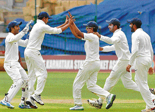 ecstatic: KSCA XI's KP Appanna (centre) celebrates after running out Rohan Belekar of Goa on Wednesday. dh photo