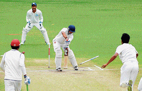 neck and crop: Ravikant Shukla of Goa is clean-bowled by Karnataka's H&#8200;S Sharath (right) on Friday.  DH&#8200;photo