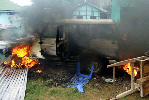 A vehicle goes up in flames after protestors demanding the creation of a separate Karbi Anglong state vandalized the residence of an official at Diphu, in Karbi Anglong district in northeastern Assam state on Wednesday. PTI Photo