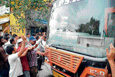 Agitators stop an APSRTC bus in Anantapur