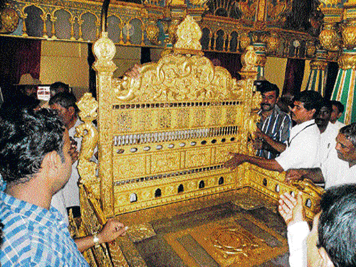 gilded resplendence: The golden throne becomes the cynosure of all eyes during Dasara, when it is thrown open for public display. dh file photo