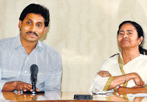 West Bengal Chief Minister Mamata Banerjee and Y S Jagan Mohan Reddy, president of YSR Congress, during a meeting in Kolkata on Wednesday. PTI