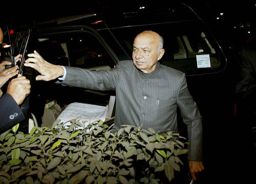 Union Home Minister Sushilkumar Shinde walks to address the media outside PM House after a Cabinet meeting on Telangana, in New Delhi on Thursday. PTI Photo