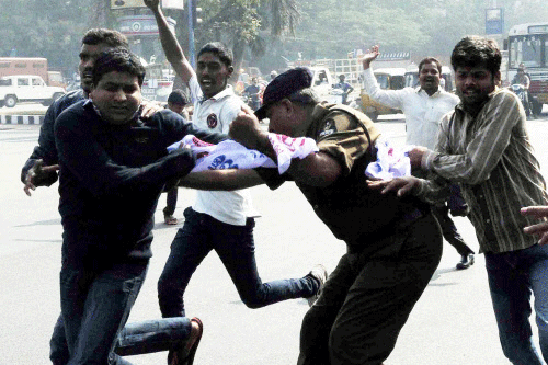 Police detaining ABVP Students while they were protesting during Andhra Pradesh Assembly session demanding introduction of Telangana Bill, in Hyderabad on Saturday. PTI