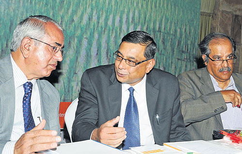 KERC chairman M R Sreenivasa Murthy interacts with Saurabh Kumar, MD of Energy Efficiency Services Limited, and Padu S Padmanaban, environment expert, at a seminar on agriculture in Bangalore on Monday. dh photo