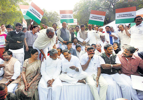 unity call: Telugu Desam Party members display placards for a united Andhra Pradesh at Parliament in New Delhi on Friday. pti