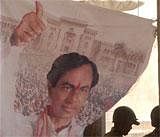 A banner depicting a portrait of TRS Chief K Chandrasekhar Rao inside the Osmania University campus. AP