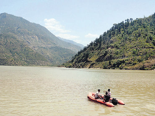 A raft is used for search operation in Beas near Pandoh Dam in Mandi on Monday. PTI