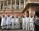 Andhra Pradesh MLAs join hands as they show their solidarity at Parliament House in New Delhi on Thursday. PTI