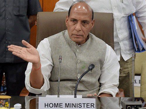 Amid Telangana Rashtra Samiti MPs voicing their protest in the Lok Sabha, Home Minister Rajnath Singh on Monday said that the Centre's move to grant special powers to the Telangana governor to manage law and order in Hyderabad was in accordance with the Andhra Pradesh Reorganisation Act, 2014. PTI photo