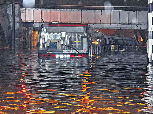 Lack of proper underground drainage systemat the Seshadripuramrailway overbridge in the City makes it difficult for buses tomove when it rains heavily. DH FILE PHOTO
