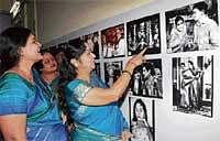 Film actor B Saroja Devi pointing out to the photographs of films in which she acted to Karnataka Film Chamber of Commerce President Jayamala at Belli Hejje a discussion programme organised by the Karnataka Chalanachitra Academy at Badami House in Bangalore on Saturday. DH Photo