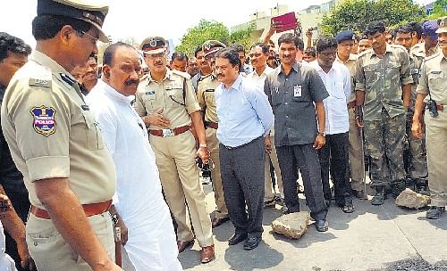 Nayini Narsimha Reddy, Minister for Home & Labour, visits the crime spot at Suryapet bus stand on Thursday.