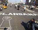 Demand for the creation of Telangana State is seen painted on a road in Hyderabad onThursday. AP