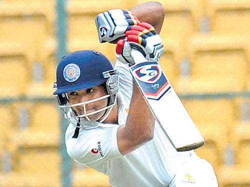 in control KSCA XI 's CM Gautam drives one during his fighting 58 against Assam CA on Sunday. dh photo