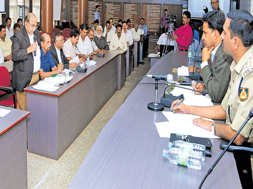 Advocate representing private bus operators addresses the meeting chaired by DC and Regional Transport Authority chairperson A B Ibrahim at the RTA, Mangaluru, on Saturday. DH photo