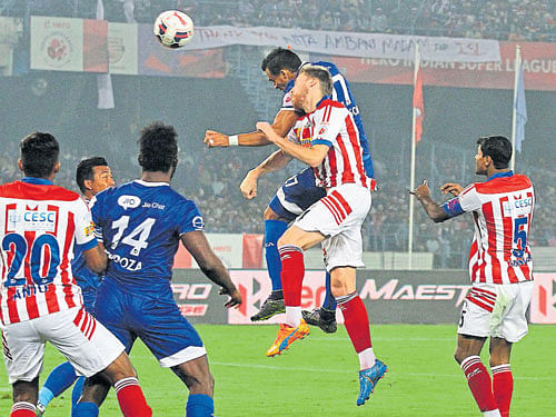 valiant effort: Chennaiyin FC's Mailson Alves (airborne right) tries to score of a corner kick during their tie against Atletico de Kolkata at the Salt Lake stadium on Wednesday in Kolkata. Kolkata won 2-1. isl media