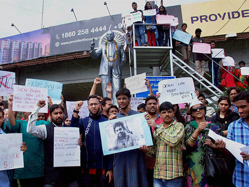 Students of HCU (Hyderabad Central University) holding a protest demanding justice for Rohit Vemmula who committed suicide, at Tank Bund on the banks of Hussain Sagar Lake in Hyderabad on Tuesday. PTI Photo