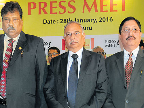 Syndicate Bank Managing Director and CEO Arun Shrivastava  (centre) flanked by Executive Directors T K Srivastava (left),  and R S Pandey, announcing the Q3 results in Bengaluru on Thursday. DH Photo by s K dinesh