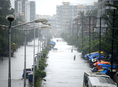 Monsoon havoc:  Normal life in the Vasai-Virar belt of the Mumbai suburbs was hit as waterlogging was reported from various places following heavy downpour. DH Photo