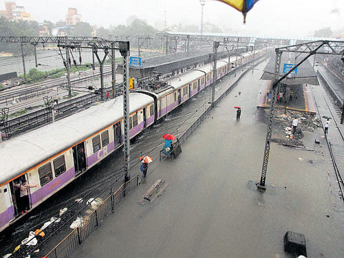 Lifeline hit: The flooded Thane station following heavy rain in Mumbai on Sunday. PTI