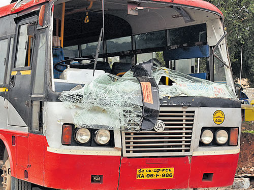 Mishap: A Sira-bound KSRTC bus which was damaged after a tree fall at Okalipuram in  Bengaluru on Wednesday. dh Photo