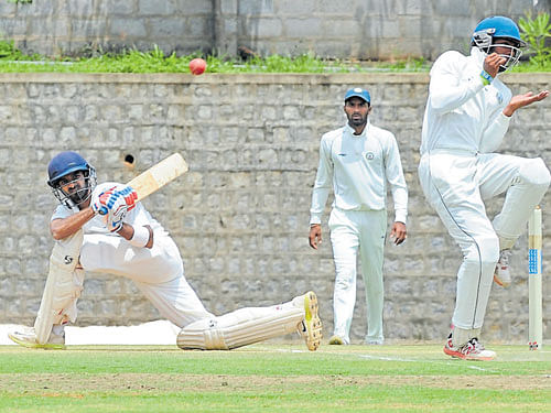 well struck Karnataka's R Samarth sweeps one en route to his 62 against Vidarbha on Friday. DH photo