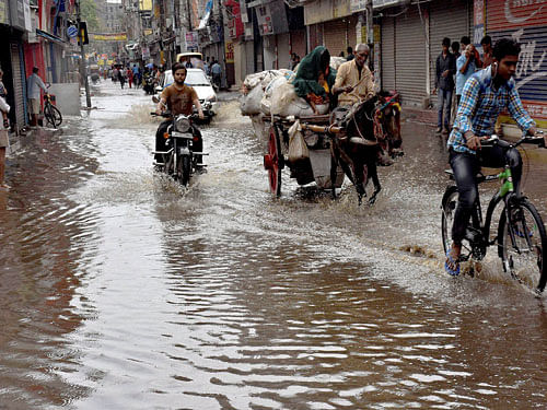 Office goers had a tough time commuting to work with several roads overflowing while many residential areas in low-lying areas also got inundated due to heavy rains. PTI file photo